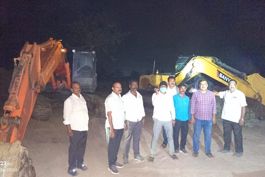 Vigilance officials seizing heavy excavators and tractors during illegal sand mining raids in Telangana