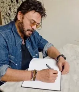 Tollywood actor Victory Venkatesh writing in the guest book at Vidyarthi Bhavan in Bengaluru