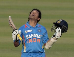 Sachin Tendulkar celebrates his 100th international century emotionally against Bangladesh in Asia Cup 2012 at Mirpur, looking to the sky with bat and helmet raised