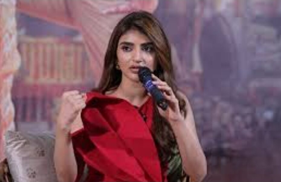 Actress Sreeleela speaking at an event about her movie songs and periods.