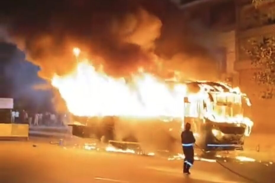 A private travels bus caught on fire in the middle of the road at KPHB, Hyderabad