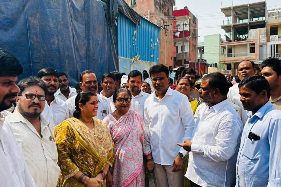 MLA KP Vivekanand interacting with residents at Vambay House Colony.